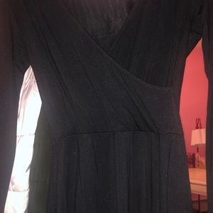 Black knee length dress with a v neck